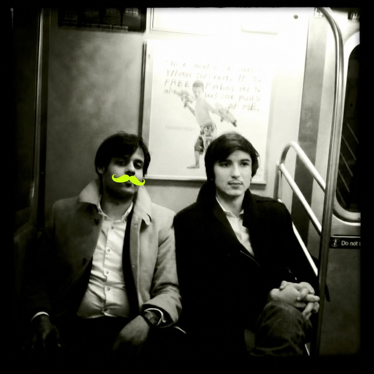 The two on the subway, mustachio'd